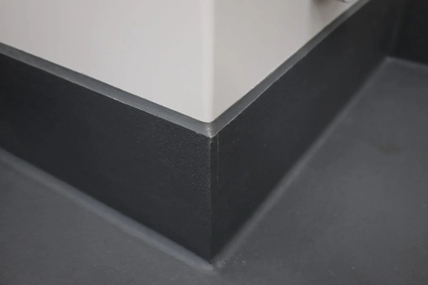 Eco-Grip integral cove base turning up the wall